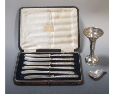 A silver caddy spoon, Birmingham 1965 together with a silver spill vase (loaded) and a cased set of silver handled butter kni