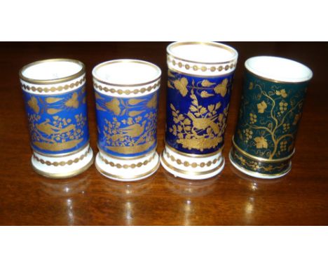 A pair of Spode and two other blue ground spill vases, gilt with birds, flowers and birds, the pair with pattern number 4054,
