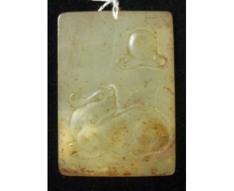 A jade rectangular pendant carved in relief on one side with a qilin and the moon  