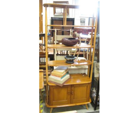 An Ercol light elm room divide  