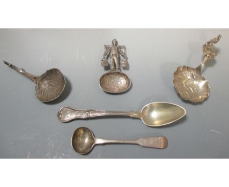 Three Dutch silver caddy spoons, a salt spoon and a silver gilt teaspoon  