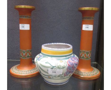 Atributed to Watcombe pottery; a pair of terracotta candlesticks and a Poole Carter Stabler Adams vase (3)  