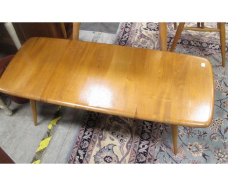 An Ercol light elm coffee table  