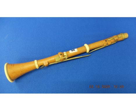 An early 19th century six key clarinet by Whitaker, London, with Ivory mounts, requires mouth piece