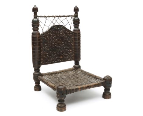 India, Swat Valley, low wooden chair, with carved backrest and woven seat (wear) h. 75 x w. 50 x d. 51 cm  Collection Asiatic