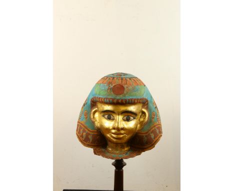 A decorative painted mummy mask h. 26 cm. on stand Provenance: Private Belgium colleciton, collected on the European art mark