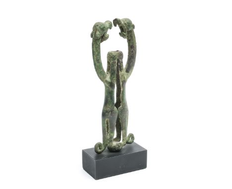Luristan, a bronze finial in the form of two confronted rampant monsters with curled tails, ca. 800-700 BC h. 12,5 cm. Proven