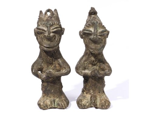 Nigeria, Yoruba, a pair of Ogboni Onile bronze figures, showing a male and a female and in their hands an attribute. H. 12,5 