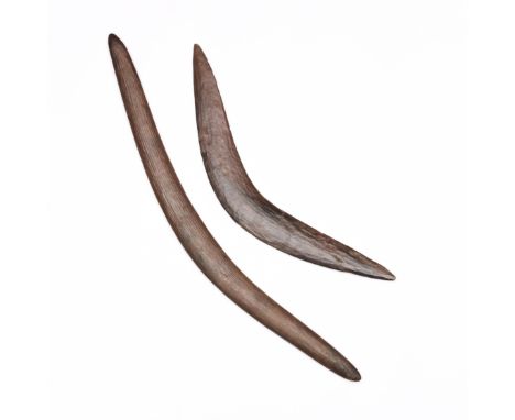 Australia, two Aboriginal boomerangs, both with a notched pattern. L. 55,5 and 76,5 cm. [2]
