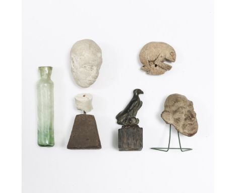 A bronze antique sculpture of a eagle, a terracotta portret, possibly Helinistic and a chalk portret bust, possibly antique; 