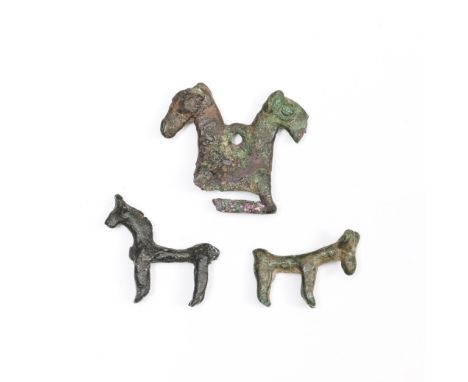 Wester Iran, three bronze small horse statues-amulets, ca. 1000-600 BC. the amulet with two horse heads and hole for hanging.