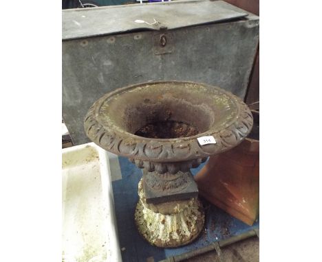 A Cast Metal Circular Planter on Unrelated Stand Together with a Terracotta Chimney