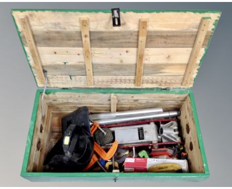 Two painted pine tool boxes containing G-clamps, welding masks, trolley jack etc 