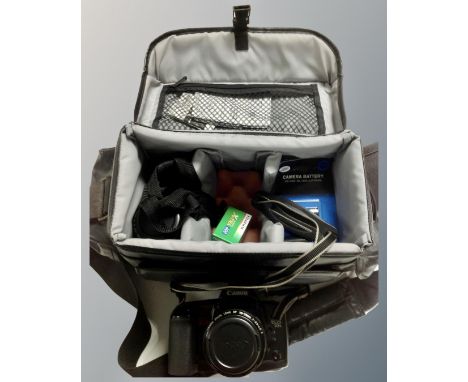 A Canon Eos 10s camera with lens and accessories in camera bag 