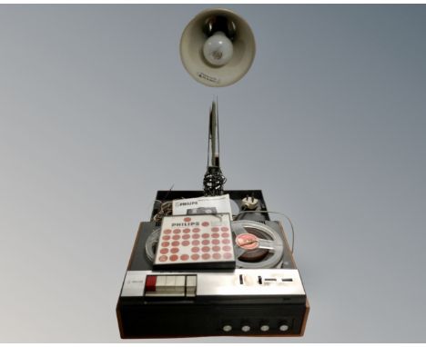 A Philips 4 track reel to reel tape recorder and a grey metal angle poise lamp 