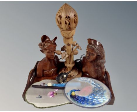 An Eastern hardwood twin handled serving tray together with two further carved busts, table lamp in the form of a flower and 