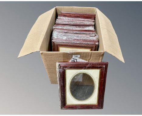 One crate containing twenty three dark wood photo frames, 20 cm x 25 cm, with oval portrait inset mounts, all brand new and i