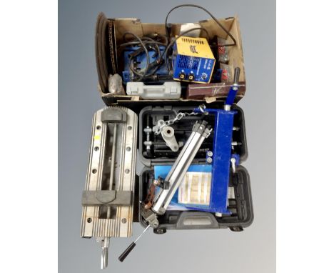A box of grinding discs, saw blades, Adendorffmma welder, tripod, mortice components etc 
