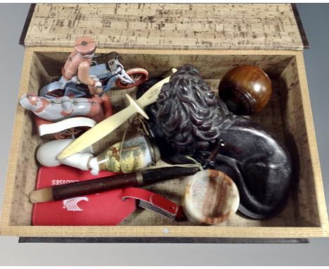 A table box in the form of a book containing vintage pipe with ceramic bowl, Weetabix letter opener, Chinese tin plated toy, 