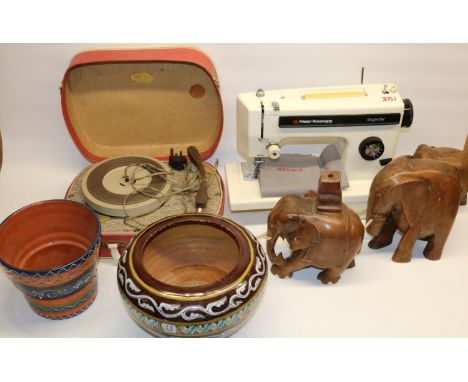 Two sewing machines incl. a Frister Rossman; elephant figures; two planters, record player, etc. 