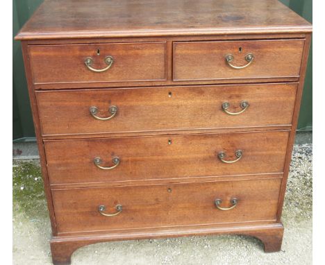George 111 oak chest of two short and three long graduated ted cockbeaded drawers, with brass handles on bracket feet, W100cm
