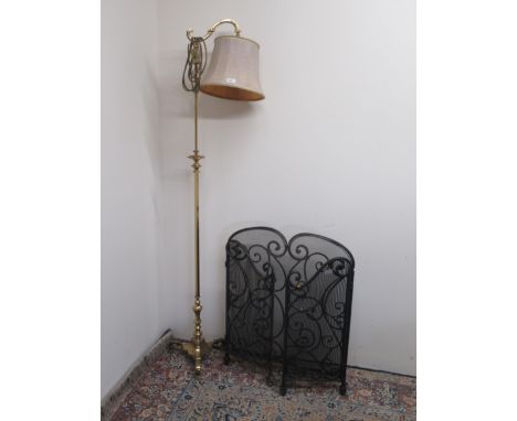 Brass adjustable floor lamp, faceted column on three down curved supports, with shade, H176cm and a black wrought metal foldi