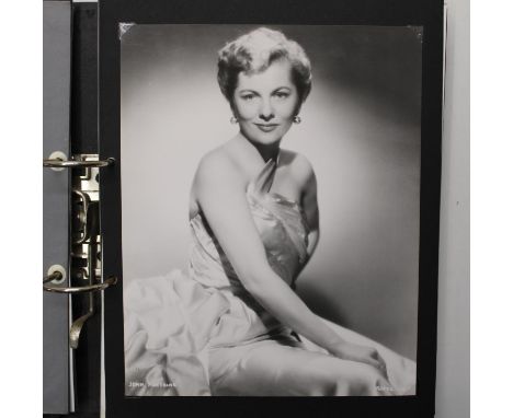 Folder of Classic Hollywood movie screen stills and portrait photographs of actors and actresses c1930s to 1960,  presented i