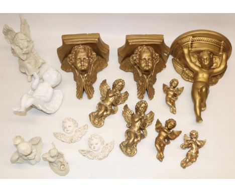 Pair of heavy gilt plaster wall sconces modelled as putti H19cm, another similar sconce H30cm, five wall hanging plaster figu