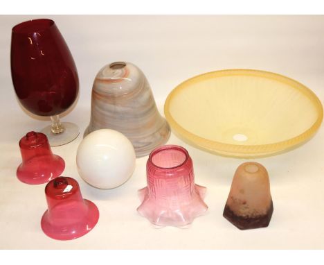 Two C19th cranberry lamp shades, five other lamp shades and a large ruby tinted brandy balloon H35cm 