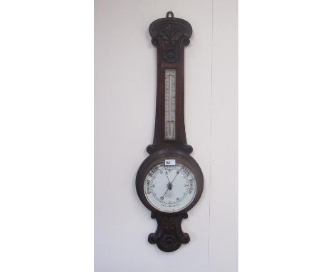 I Henri London - C20th carved oak aneroid wheel barometer with thermometer, H90.5cm 