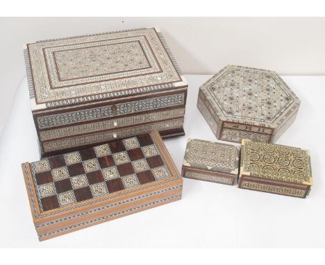 Folding wooden backgammon/chess games box with mother of pearl inlay, four wooden jewellery boxes with mother of pearl inlay 