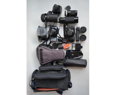 Collection of 35mm SLR cameras and accessories to include Canon A-1 with Canon 28mm and 50mm lenses, Sunagor 80-305 Macro Zoo