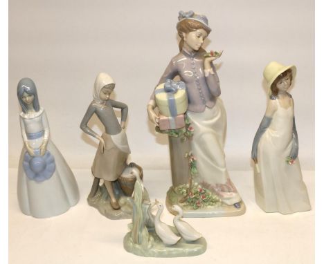 Lladro figure of a girl with milk pail and duck, H24cm; Nao figure group of three ducks; and three similar figures incl. Nada