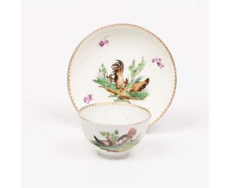 A Hague tea bowl and saucer, circa 1780, decorated hens and puce flowers, underglaze blue stork mark CONDITION REPORT: Very g