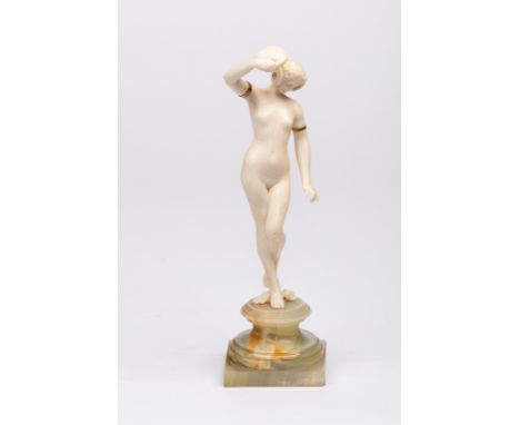 Louis Sosson (act.1905-1930), an Art Deco ivory figure of a tambourine girl, nude with inlaid metal bands to her arms and cle