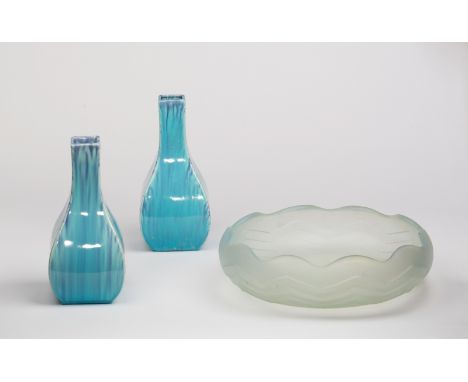 An Art Deco style bowl, opalescent blue glass with zigzag design, 27cm diameter and a pair of ceramic bottle vases of square 