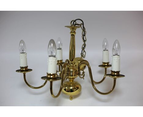 A brass five-light electrolier with scroll branches