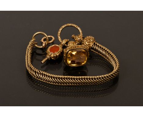 A fine early 19th Century watch fob, the intaglio carved a citrine matrix with armorial, on an unmarked articulated watch cha