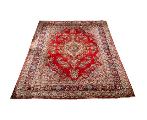 A Mahal carpet, West Persia, mid 20th Century, with central red ground, floral field and figured border, 371cm x 263cm CONDIT
