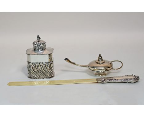 A silver embossed tea caddy and cover, London 1894, a silver handled paper knife with ivory blade and a small silver table la