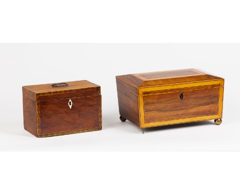 An early 19th Century satin birch tea caddy with tunbridge banding and ring handle to the cover (the interior now material li