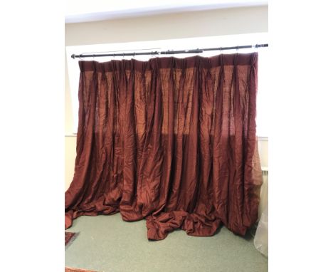 A pair of dark red silk curtains with pelmet and tie backs, 250cm x 240cm Provenance: Property of Sir Roy Strong CH, FRSL