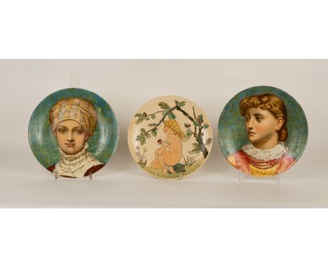 Two Minton portrait plates, painted by J Keeling, circa 1890, with historical revival portraits of women reserved on a mottle