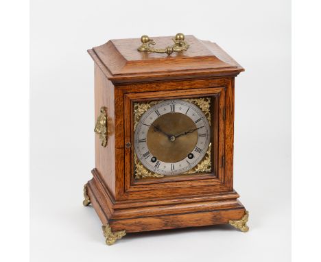 An eight-day bracket clock of 18th Century design, in an oak case fitted a twin cylinder movement with brass dial, Roman nume