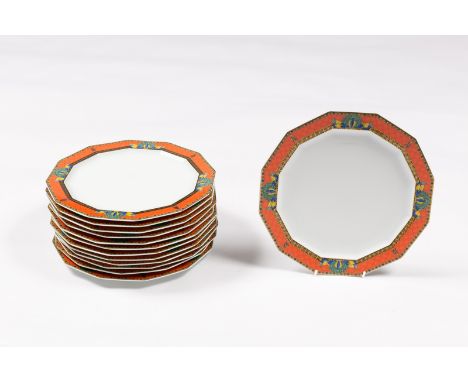 Thirteen Rosenthal Versace Le Voyage de Marco Polo dinner plates of dodecagon shape, with peacocks to the salmon pink ground 