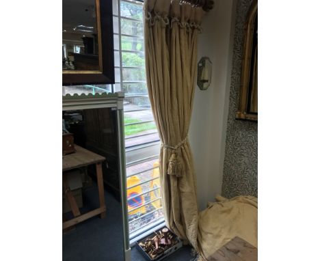 A pair of yellow damask curtains with tassels, 210cm x 254cm, the pole and a gilded eagle surmount for the same and two other
