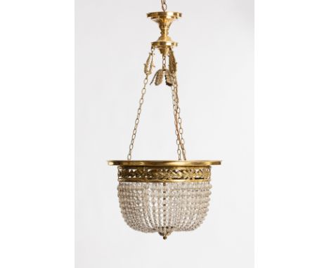 An Edwardian pendant chandelier with leaf and ribbon border, hung forty-eight trails of tapered prismatic beads and with trip