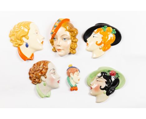 A group of Czechoslovakian wall masks, ladies' faces in the Art Deco style, various sizes (some damages) CONDITION REPORT: Bl