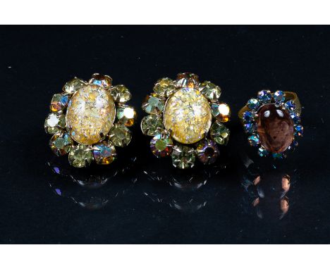 A pair of 1940s style iridescent crystal cluster clip earrings and a similar style adjustable ring with central pink coloured