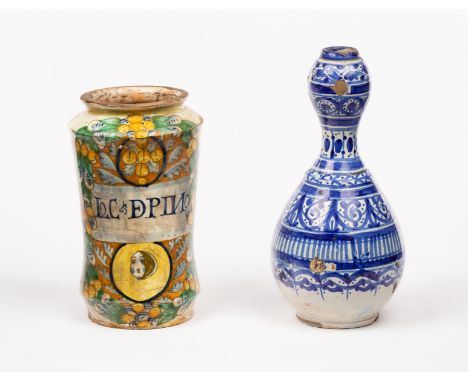 An Italian polychrome maiolica albarello, 17th Century, inscribed LoC De PINO, 20cm high, and a 19th Century faience bottle p